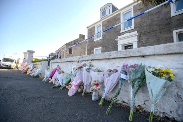 Floral tributes at the house where Alesha MacPhail was staying