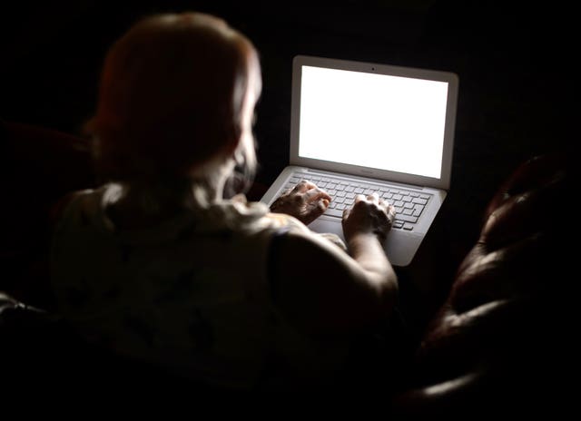 Generic stock photo shows a woman using a laptop computer