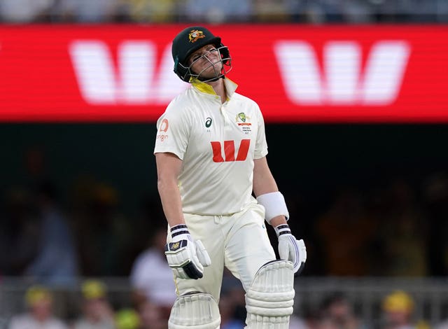 Steve Smith reacts after being hit on the arm