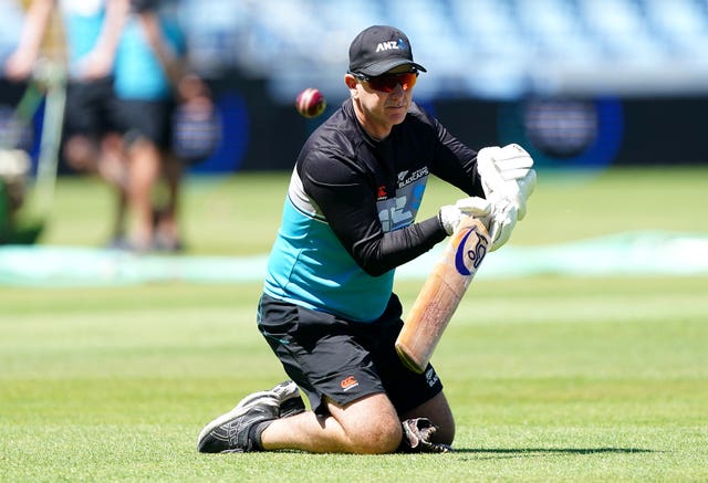 New Zealand head coach Gary Stead provides catching practice during nets.