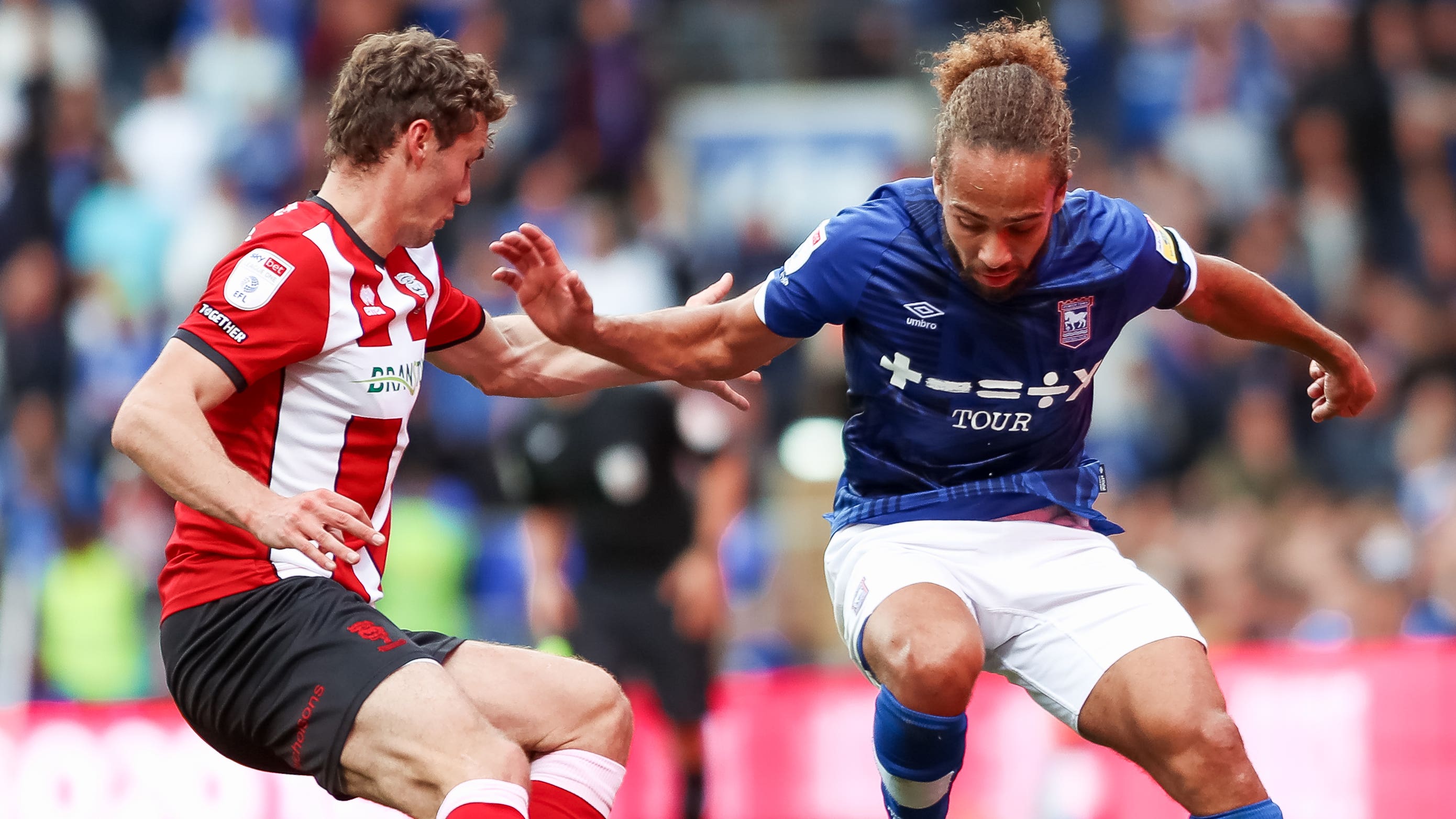 Lincoln City’s Max Sanders (left) and Ipswich’s Wes Burns battle for the ball (Rhianna Chadwick/PA)