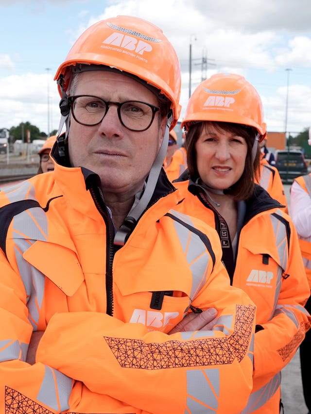 Sir Keir and shadow chancellor Rachel Reeves wearing orange hi-vis and hard hats during a visit to Ocean Gate, Eastern Docks in Southampton