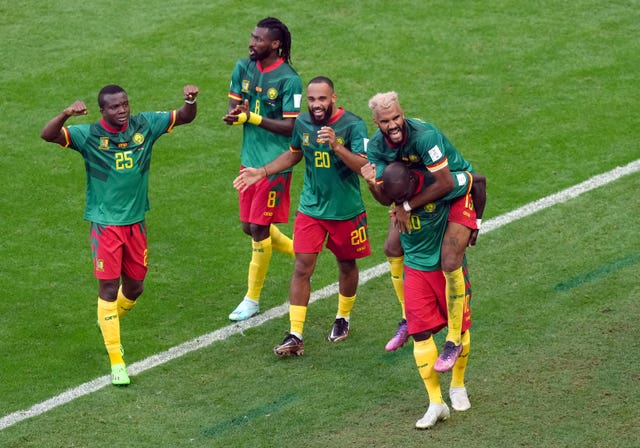 Cameroon’s Eric Maxim Choupo-Moting, right, celebrates scoring his side''s equaliser against Serbia 