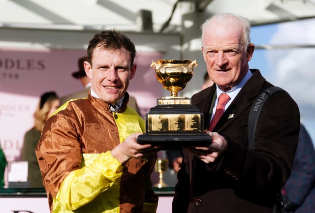 Paul Townend and Willie Mullins celebrate with the Gold Cup 