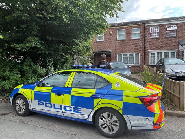 Police outside the property in Hopyard Close, Leicester