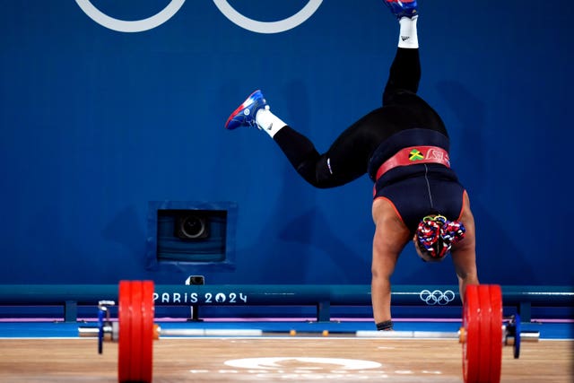 Great Britain’s Emily Campbell celebrates with a cartwheel after winning Olympic bronze