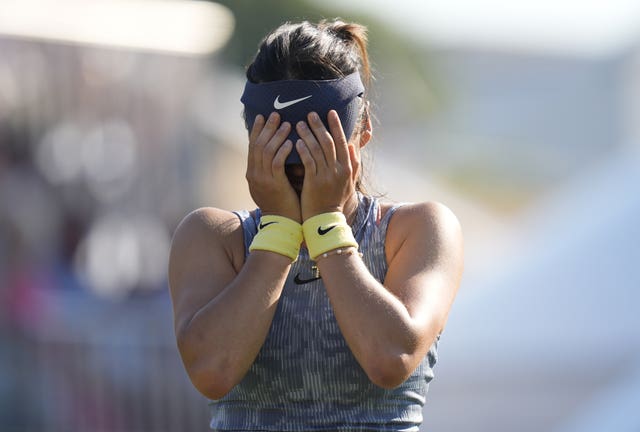 Emma Raducanu covers her face with her hands after beating Jessica Pegula in Eastbourne 