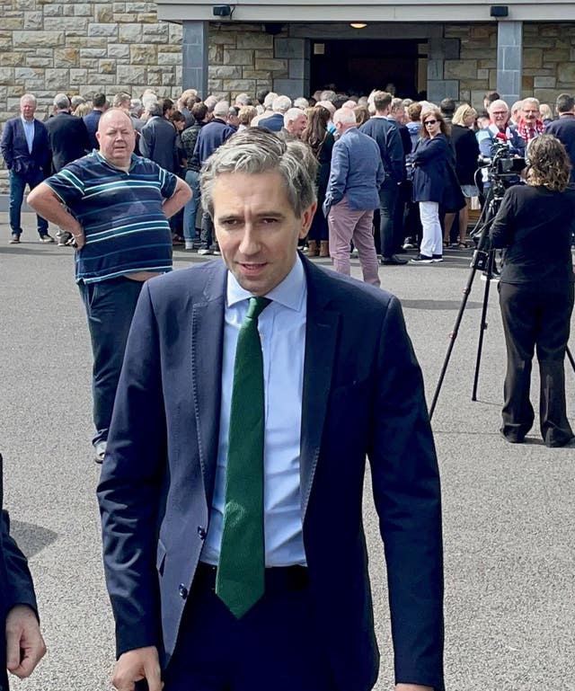 Taoiseach Simon Harris leaves the church after the funeral of veteran RTE journalist Tommie Gorman at Our Lady Star of the Sea Church in Ransboro, Co Sligo