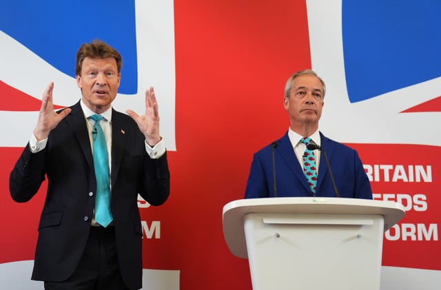 Richard Tice gestures as he and Nigel Farage announce their party’s economic policy  