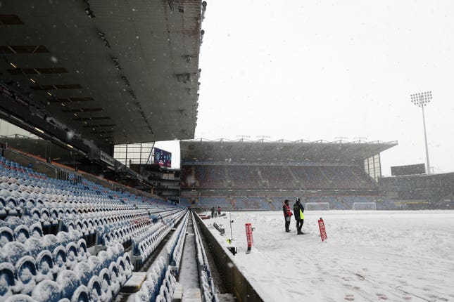 A view of snow on the pitch as the game is abandoned before the Premier League match at Turf Moor between Burnley and Tottenham