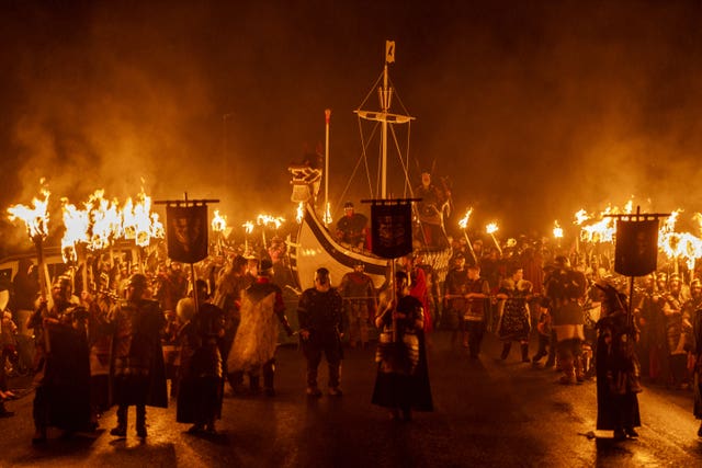 The Jarl Squad take part in the torch procession through Lerwick on the Shetland Isles during the Up Helly Aa festival
