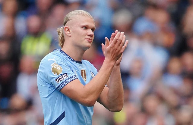 Erling Haaland applauds the fans as he leaves the pitch