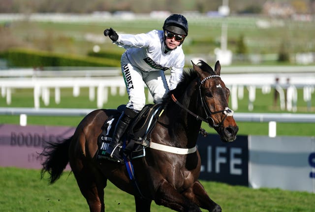 Nico de Boinville celebrates winning the Champion Hurdle 