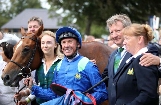 Frankie Dettori with Mark Johnston after riding Poet’s Society to a record-breaking victory at York