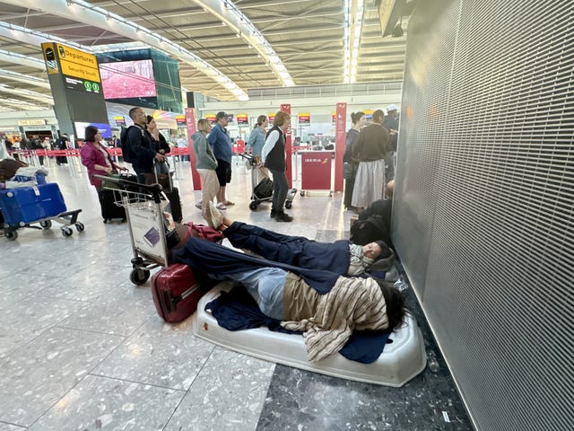Passengers at Heathrow Airport in west London, during disruption after a system issue hit Nats
