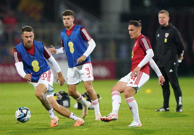 Aaron Ramsey, left, started for Wales