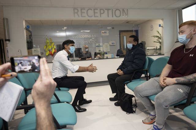 Prime Minister Rishi Sunak talks with a patient, Riaz Ahmad, during a visit to Oldham Community Diagnostic Centre in Greater Manchester 