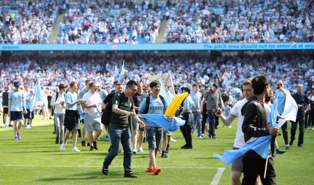 The full-time whistle sparked a pitch invasion at the Etihad Stadium 