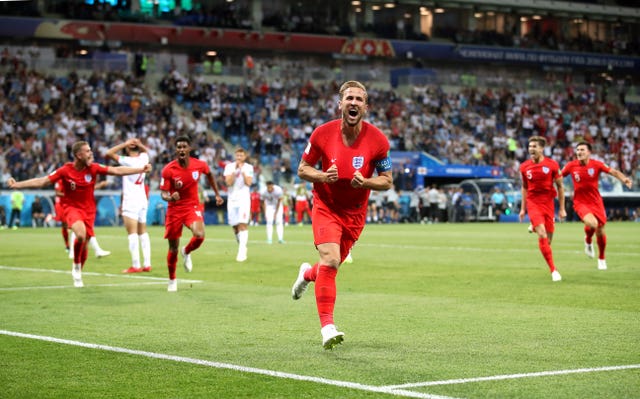Harry Kane celebrates his winner in the opening game against Tunisia