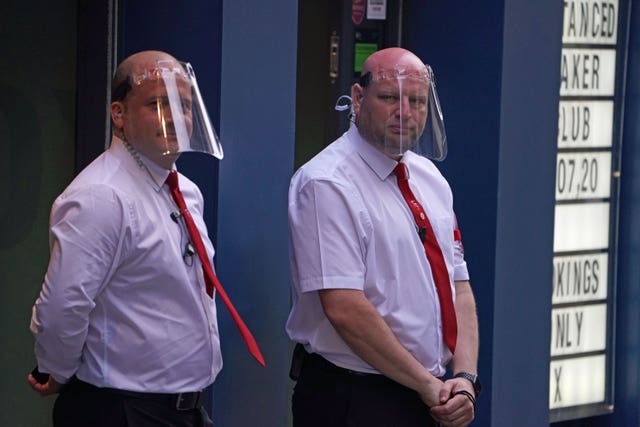 Door staff in PPE outside Market Shaker in the Bigg Market area of Newcastle (Owen Humphreys/PA)