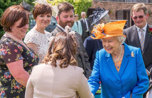 The Queen meets Duchy of Lancaster estate staff and tenants during a visit to Lower Castle Hayes farm, in Draycott-in-the-Clay, Ashbourne, Staffordshire. Richard Stonehouse/PA Wire