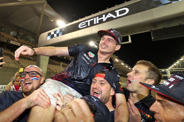 Max Verstappen celebrates with his team