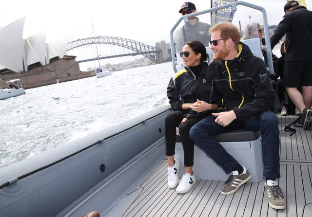 The Duke and Duchess of Sussex held hands while watching the sailing