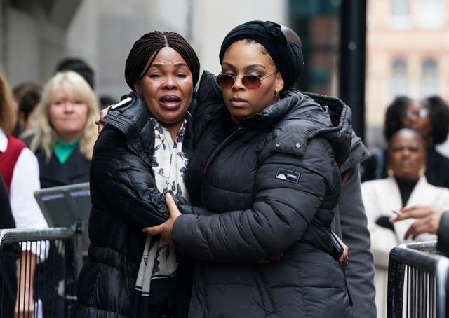 Helen Lumuanganu (left), the mother of Chris Kaba, arriving at the Old Bailey