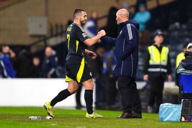 John McGinn, left, is congratulated by manager Steve Clarke after scoring Scotland’s winner against Croatia