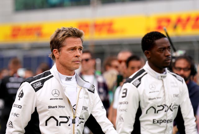 Brad Pitt and Damson Idris filming during the British Grand Prix (Tim Goode/PA)