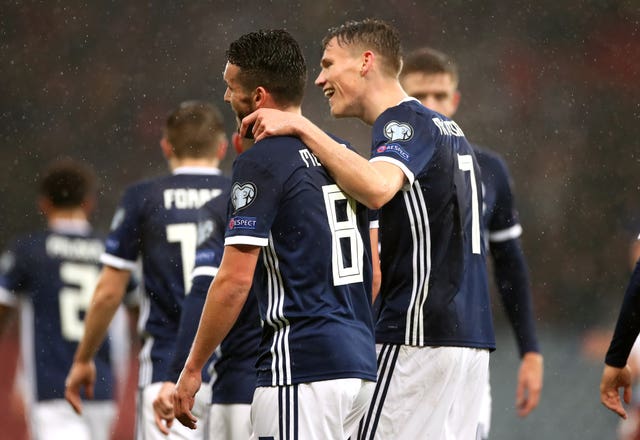 Dalglish says Premier League stars like John McGinn (left) and Scott McTominay can help Scotland be competitive