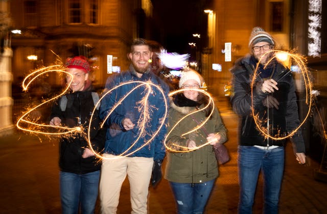 Revellers during the Hogmanay New Year celebrations in Edinburgh (Jane Barlow/PA)