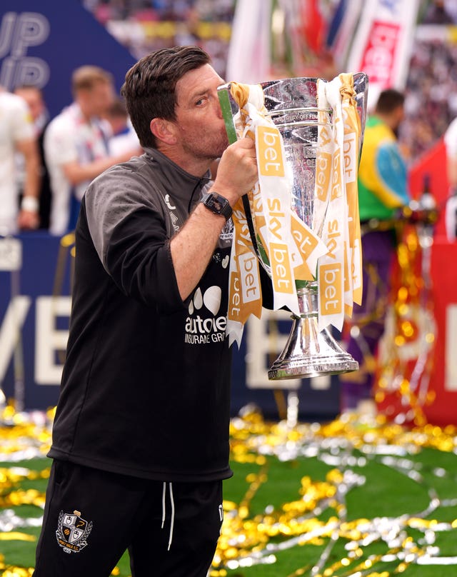 Port Vale manager Darrell Clarke with the League Two play-off final trophy after his side's 3-0 win over Mansfield at Wembley