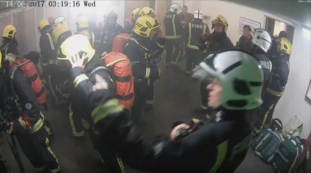 Glynn Williams (top of photo pointing at wall) marshalling firefighters in the tower 