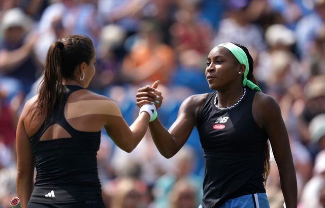 Jodie Burrage, left, shakes hands with Coco Gauff at Eastbourne