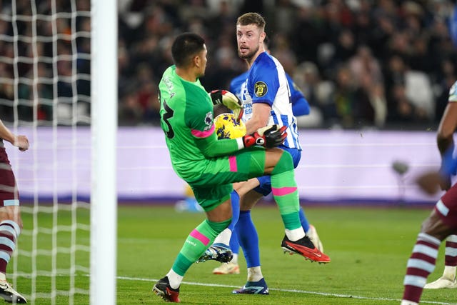 Alphonse Areola, left, saves from Brighton’s Adam Webster