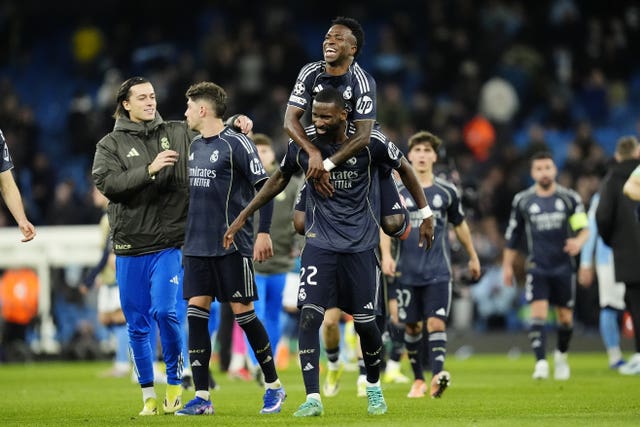 Real Madrid’s Vinicius Junior (top) and Antonio Rudiger celebrate