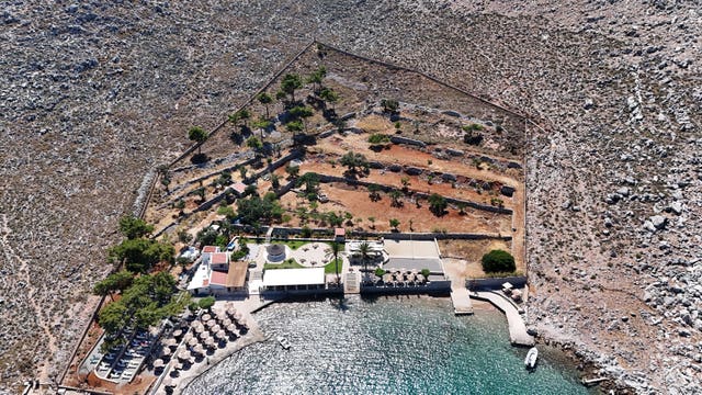 Agia Marina in Symi, Greece, after the body of TV doctor and columnist Michael Mosley was removed from the rocks on the right-hand side of the compound