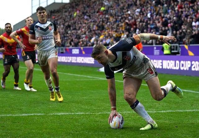 Tommy Makinson scores a try during England's quarter-final victory over Papua New Guinea (Tim Goode/PA).