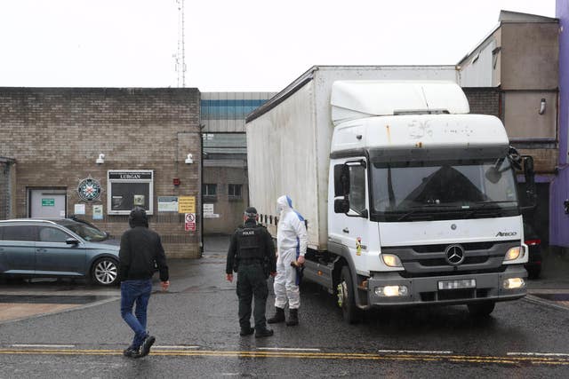 A forensic recovery lorry leaves the police station in Lurgan, Co Armagh