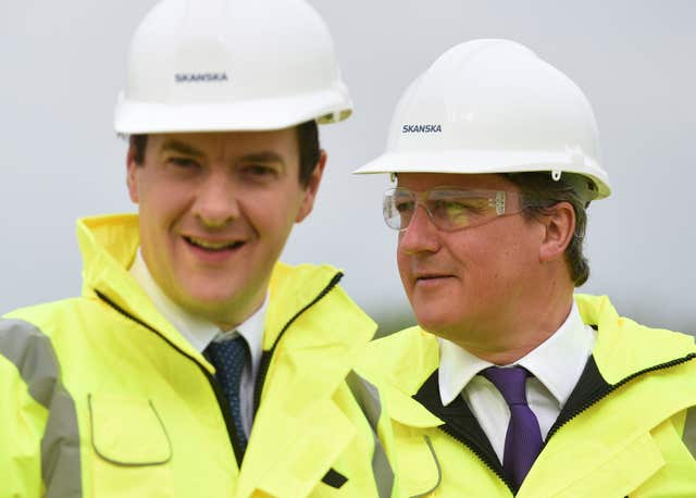 George Osborne and David Cameron in hard hats and hi vis jackets