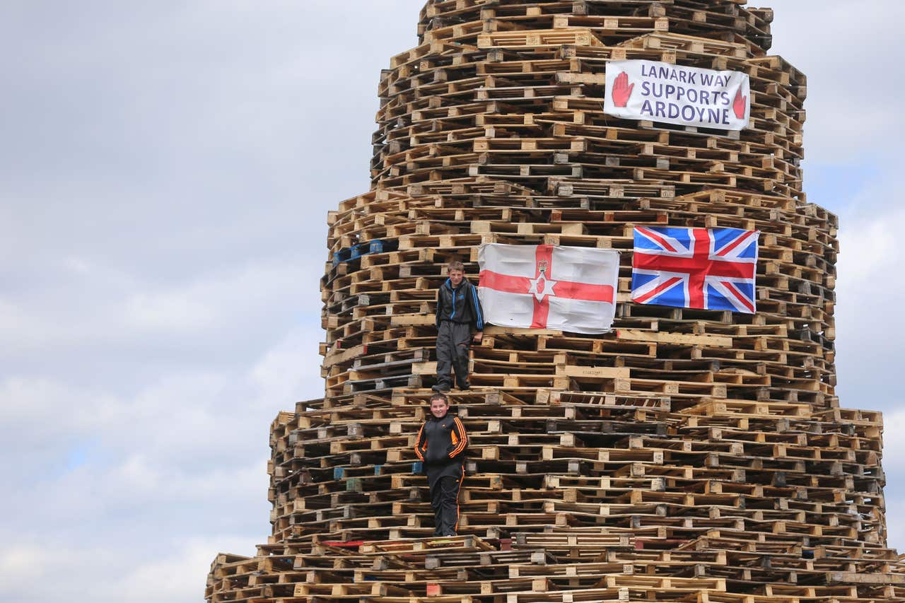 Why are huge bonfires lit across Northern Ireland on Eleventh Night