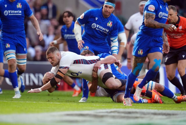 England’s Tom Willis dives over for the opening try against Italy