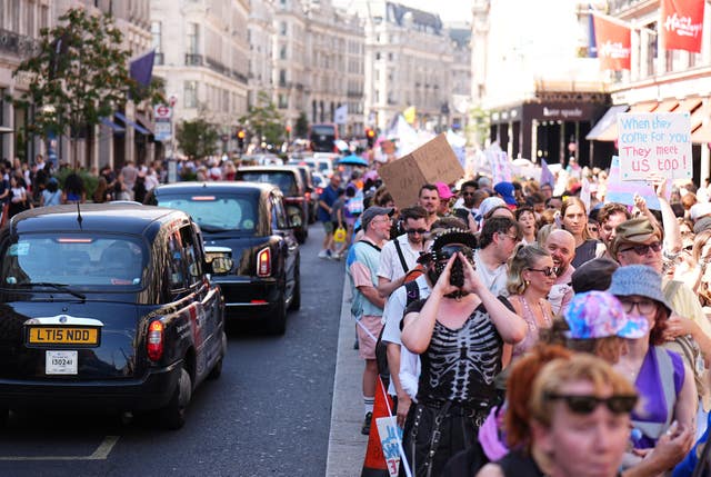 People take part in the London Trans+ Pride march in central London