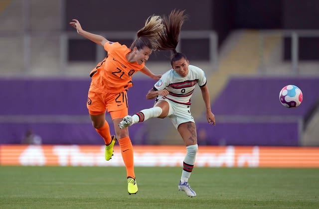 Holland's Damaris Egurrola, left and Portugal’s Ana Borges battle for the ball during their Group C match 