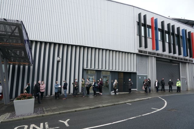 People queue outside the NHS vaccine centre in Newcastle (Owen Humphreys/PA) 