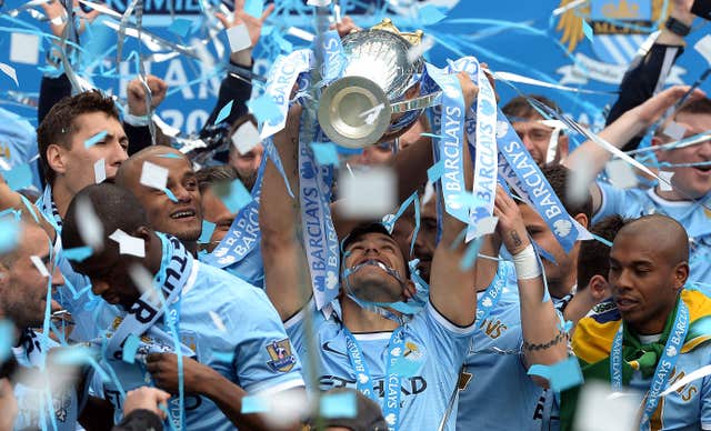 Sergio Aguero lifts the Premier League trophy in 2014