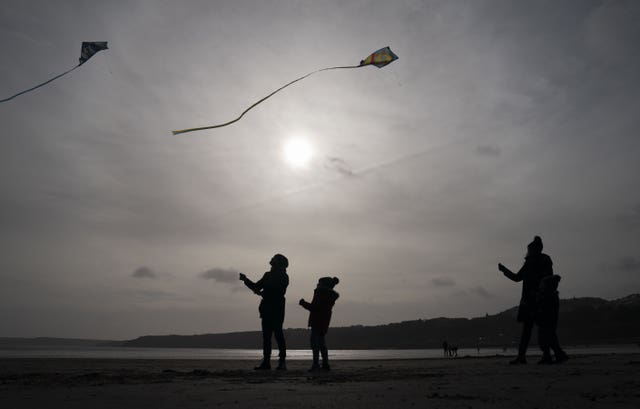 People fly Kites on Scarborough beach in North Yorkshire, as Storm Dudley hits the north of England/southern Scotland from Wednesday night into Thursday morning, closely followed by Storm Eunice, which will bring strong winds and the possibility of snow on Friday