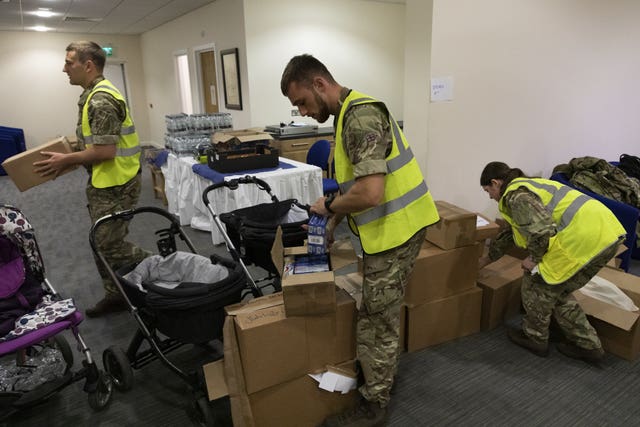 RAF personnel packing necessities for Afghan nationals arriving at RAF Brize Norton