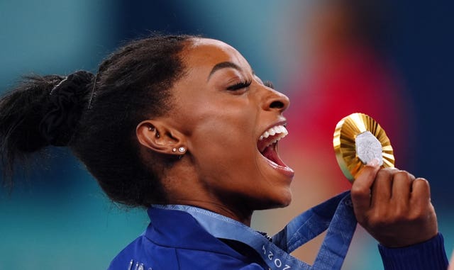 Simone Biles with her gold medal 